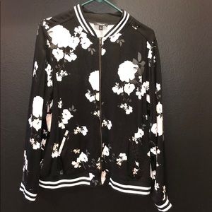 Flowered zip up jacket.